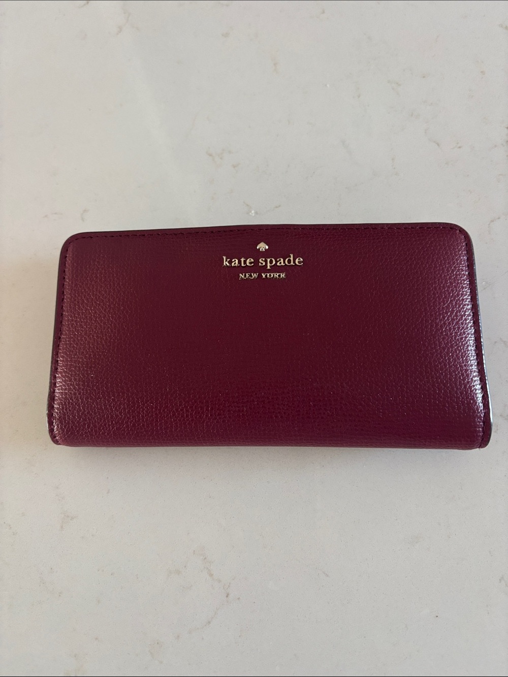 kate spade Plum Pebbled Leather Zip Wallet with Gold Logo